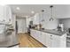 Modern kitchen with white cabinets, quartz countertops, and stainless steel appliances at 7245 E Cambridge Ave, Scottsdale, AZ 85257