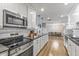 Open concept kitchen with stainless steel appliances and an island at 7245 E Cambridge Ave, Scottsdale, AZ 85257