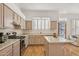 Kitchen with island, light wood cabinets, and patio access at 7297 E Black Rock Rd, Scottsdale, AZ 85255