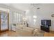 Living room with view of patio, hardwood floors and sofas at 7297 E Black Rock Rd, Scottsdale, AZ 85255