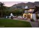 Outdoor patio area with lounge chairs and a built-in grill at 7348 N Red Ledge Dr, Paradise Valley, AZ 85253