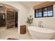 Elegant bathroom with freestanding tub and walk-in shower at 7348 N Red Ledge Dr, Paradise Valley, AZ 85253