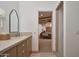 Elegant bathroom with dual sinks and a view into a bedroom at 7348 N Red Ledge Dr, Paradise Valley, AZ 85253