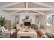 Bright living room with a fireplace and large windows, featuring comfortable seating at 7348 N Red Ledge Dr, Paradise Valley, AZ 85253