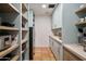 Well-organized pantry with ample shelving and counter space at 7348 N Red Ledge Dr, Paradise Valley, AZ 85253