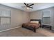 Spacious bedroom with carpeted floors and ceiling fan at 7950 S 45Th Ave, Laveen, AZ 85339