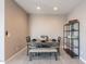 Simple dining area with a dark wood table and bench, and a modern shelf at 7950 S 45Th Ave, Laveen, AZ 85339