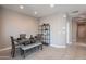 Small dining area with dark wood table, bench seating, and modern shelving at 7950 S 45Th Ave, Laveen, AZ 85339