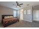 Main bedroom with ensuite bathroom and a ceiling fan at 7950 S 45Th Ave, Laveen, AZ 85339