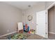 playroom with toys, easel, and alphabet rug at 7950 S 45Th Ave, Laveen, AZ 85339