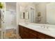 Double vanity bathroom with large mirror and tile floor at 8531 E Twisted Leaf Dr, Gold Canyon, AZ 85118