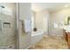 Elegant bathroom with soaking tub, shower, and double vanity at 8531 E Twisted Leaf Dr, Gold Canyon, AZ 85118