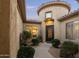 Charming courtyard entry with a circular wall and lush greenery at 8531 E Twisted Leaf Dr, Gold Canyon, AZ 85118