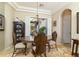 Formal dining room with chandelier and large window at 8531 E Twisted Leaf Dr, Gold Canyon, AZ 85118