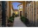 Elegant entryway with wrought iron gate and courtyard at 8531 E Twisted Leaf Dr, Gold Canyon, AZ 85118