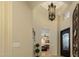 Elegant entryway with a decorative chandelier and wrought iron door at 8531 E Twisted Leaf Dr, Gold Canyon, AZ 85118