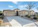 Beautiful home exterior with a large driveway and landscaping at 8531 E Twisted Leaf Dr, Gold Canyon, AZ 85118