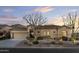 Single story home with desert landscaping at dusk at 8531 E Twisted Leaf Dr, Gold Canyon, AZ 85118