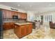 Modern kitchen with wood cabinets and granite island at 8531 E Twisted Leaf Dr, Gold Canyon, AZ 85118