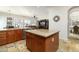 Large kitchen island with granite countertop and seating at 8531 E Twisted Leaf Dr, Gold Canyon, AZ 85118