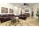 Cozy living room with leather furniture and tile flooring at 8531 E Twisted Leaf Dr, Gold Canyon, AZ 85118