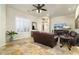 Comfortable living room with leather sofas and a large window at 8531 E Twisted Leaf Dr, Gold Canyon, AZ 85118