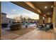 Covered patio with outdoor dining and pool view at 8531 E Twisted Leaf Dr, Gold Canyon, AZ 85118