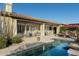 Inviting pool area with patio furniture and shade structures at 8531 E Twisted Leaf Dr, Gold Canyon, AZ 85118