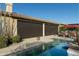 Relaxing pool area with covered patio and sunshades at 8531 E Twisted Leaf Dr, Gold Canyon, AZ 85118