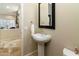 Clean powder room with pedestal sink and mirror at 8531 E Twisted Leaf Dr, Gold Canyon, AZ 85118