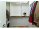 Bright walk-in closet with custom shelving and hanging rods at 8531 E Twisted Leaf Dr, Gold Canyon, AZ 85118