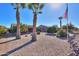 Backyard oasis with palm trees and a view of the golf course at 9 N Agua Fria Ln, Casa Grande, AZ 85194