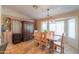 Charming dining room with rustic wood table and chandelier at 9 N Agua Fria Ln, Casa Grande, AZ 85194