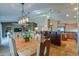 Open dining area with a view into the kitchen and living room at 9 N Agua Fria Ln, Casa Grande, AZ 85194