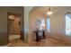 Bright entryway with tile flooring and a wooden console table at 9 N Agua Fria Ln, Casa Grande, AZ 85194