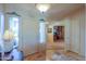 Home entryway with tile flooring and built-in shelving at 9 N Agua Fria Ln, Casa Grande, AZ 85194