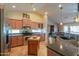 Open kitchen with stainless steel appliances and butcher block island at 9 N Agua Fria Ln, Casa Grande, AZ 85194