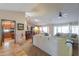 Open living room with a view into the kitchen and dining area at 9 N Agua Fria Ln, Casa Grande, AZ 85194