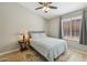 Guest bedroom with a queen bed and wood floors at 9815 N Sunrise Cir, Fountain Hills, AZ 85268