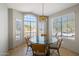 Bright dining area with glass-top table and four chairs at 9815 N Sunrise Cir, Fountain Hills, AZ 85268