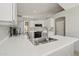 Modern kitchen with white cabinets and a large sink at 9815 N Sunrise Cir, Fountain Hills, AZ 85268