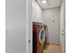 Convenient laundry room with washer, dryer, and extra cabinets at 9815 N Sunrise Cir, Fountain Hills, AZ 85268