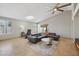 Spacious living room featuring a sectional sofa and large windows at 9815 N Sunrise Cir, Fountain Hills, AZ 85268