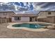 Inviting kidney-shaped pool surrounded by desert landscaping at 9909 W Miami St, Tolleson, AZ 85353