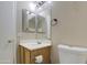 Bathroom with vanity, toilet and mirror at 9909 W Miami St, Tolleson, AZ 85353