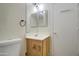 Bathroom with vanity, toilet and mirror at 9909 W Miami St, Tolleson, AZ 85353