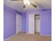 Purple bedroom with ceiling fan and closet at 9909 W Miami St, Tolleson, AZ 85353