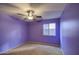 Light purple bedroom with ceiling fan and carpeting at 9909 W Miami St, Tolleson, AZ 85353