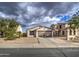 One-story house with a two-car garage and driveway at 9909 W Miami St, Tolleson, AZ 85353