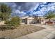 Single-story house with a two-car garage and side yard at 9909 W Miami St, Tolleson, AZ 85353